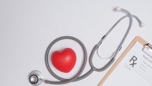 stethoscope with heart stethoscope red heart wooden table hospital life insurance concept world heart health day idea medicine pharmacy concept empty medical form ready be used scaled